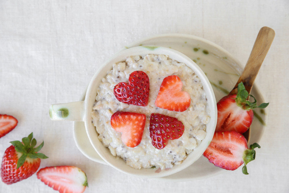 Oatmeal with heart shaped strawberries