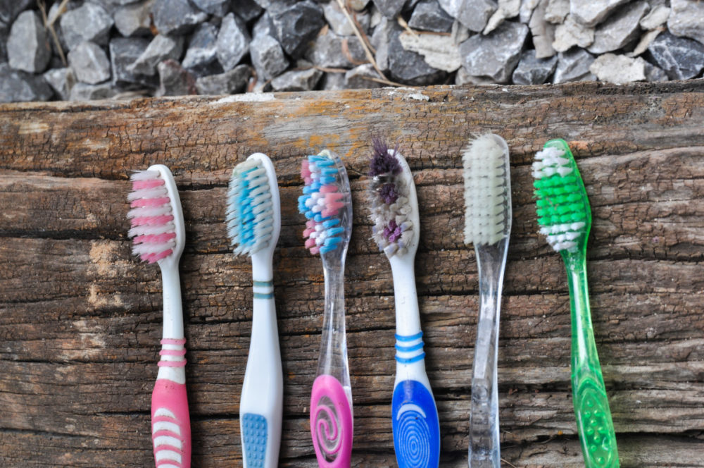 Toothbrushes on wood