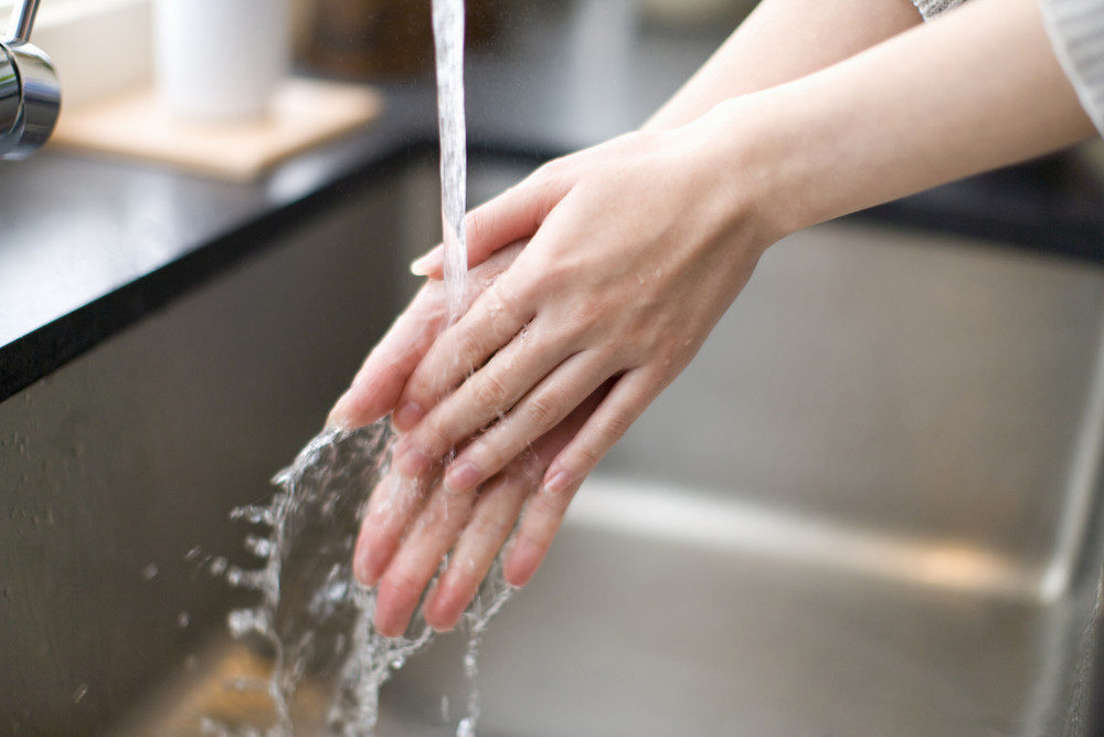 Woman washing her hands