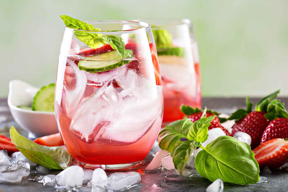Cucumber, strawberry and basil water in glass